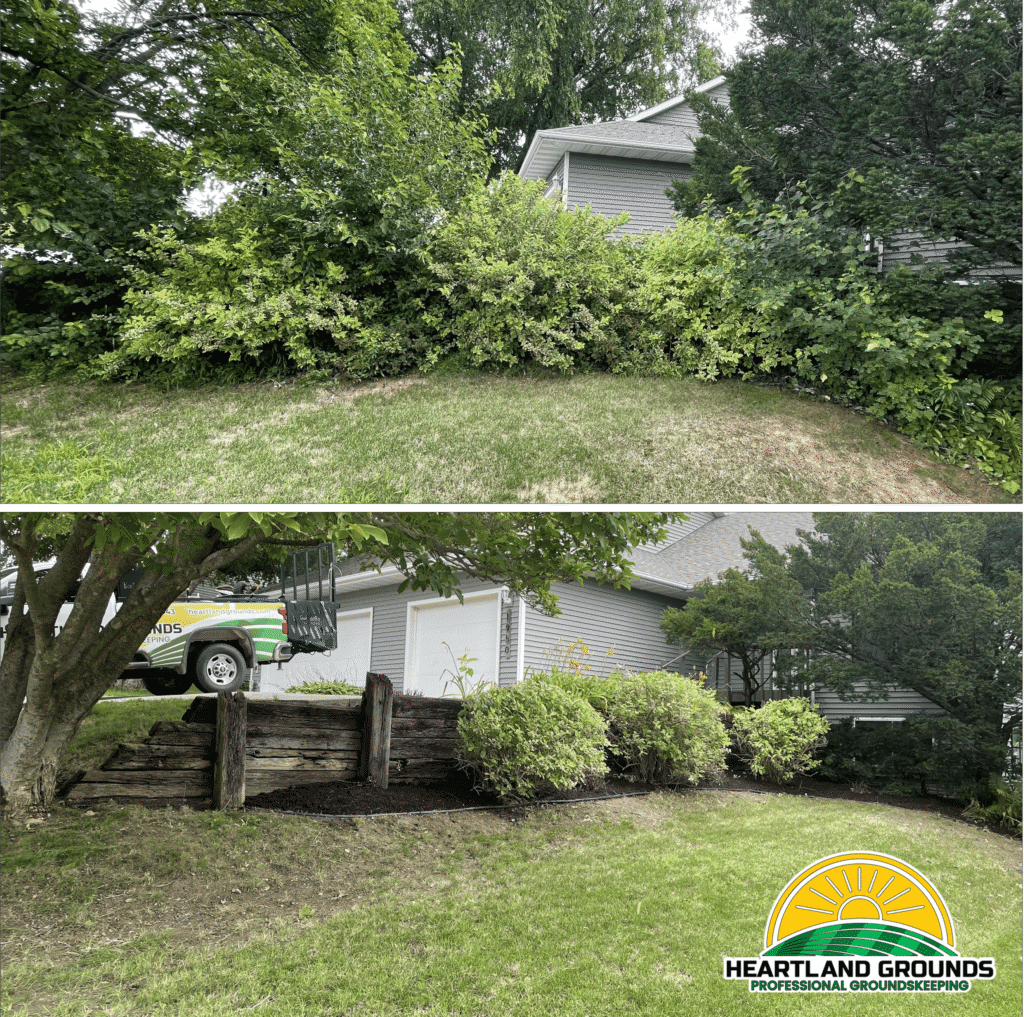Before-and-after photo of a hillside property cleanup by Heartland Grounds. The top image shows a large area of dense, overgrown shrubs covering a retaining wall and garage. The bottom image shows the same area after professional trimming and cleanup, with neatly shaped bushes, fresh mulch, and the retaining wall and structure clearly visible. A Heartland Grounds truck and logo appear in the image.